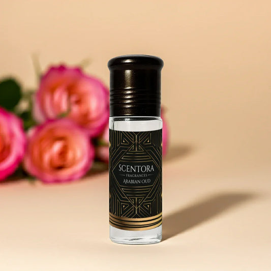 Scentora Arabian Oud roll-on perfume bottle with roses on a beige background