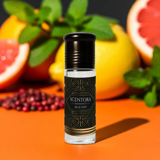Scentora Blue Dive roll-on perfume bottle with citrus, mint leaves, and peppercorns